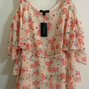 Floral shoulder strap blouse.